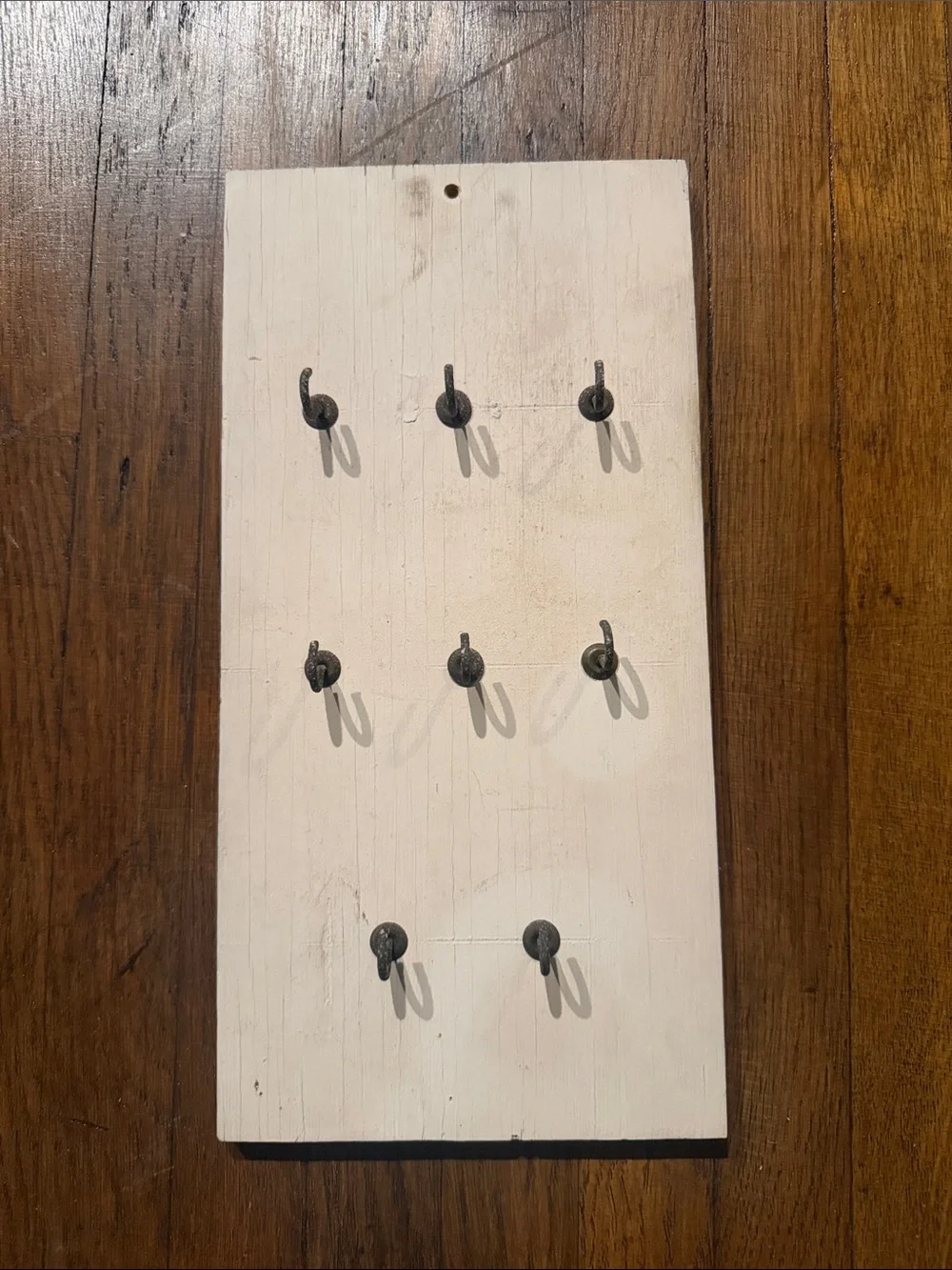 Rustic old worn Wooden Wall Hook Board in Cream with Black Hooks